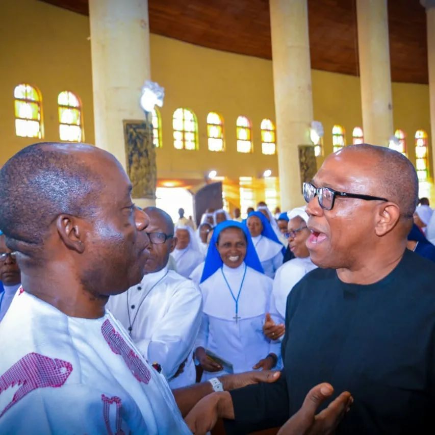 At a thanksgiving ceremony, Peter Obi and Soludo embrace. Days earlier, the governor of Anambra state had openly criticized Obi.